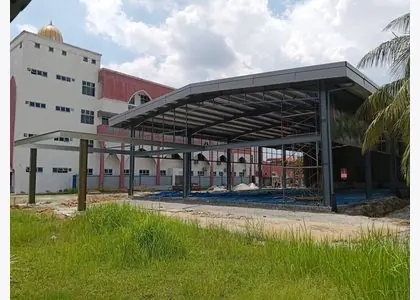 Commercial steel canopy structure with metal roofing
