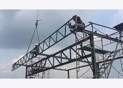 Steel roof truss installation work at height