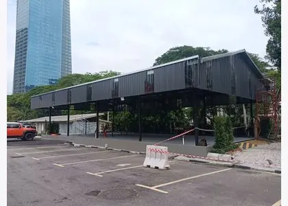 Metal awning extension installed beside a commercial building