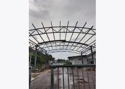 Curved steel roof frame under fabrication